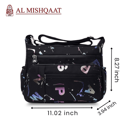 Black handbag with colorful patterns featuring the brand 'Al Mishqaat'.