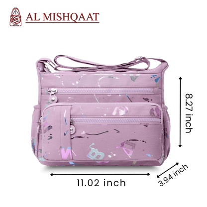 Large stylish crossbody alphabet bag in lavender with multicolor letter print, featuring multiple zippered compartments for fashion and versatility.
