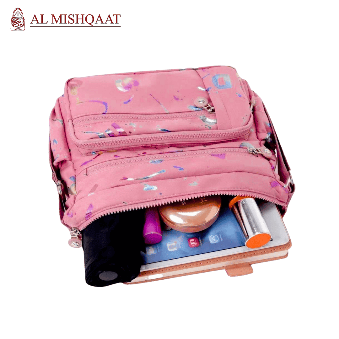 Large stylish crossbody alphabet bag in lavender with multicolor letter print, featuring multiple zippered compartments for fashion and versatility.

