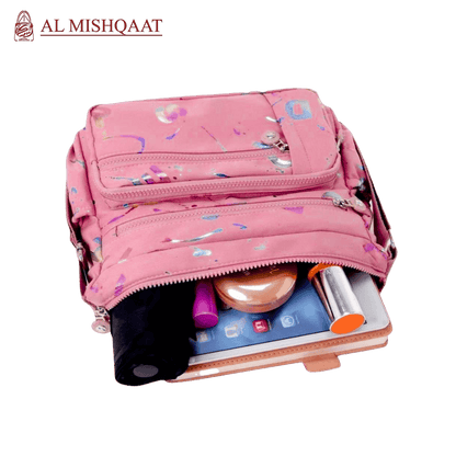 Large stylish crossbody alphabet bag in lavender with multicolor letter print, featuring multiple zippered compartments for fashion and versatility.
