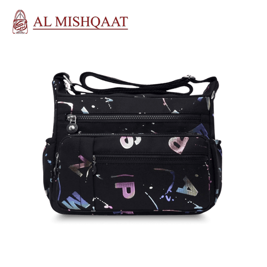 Black handbag with colorful abstract patterns branded 'Al Mishqaat'.