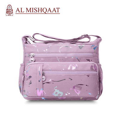 Large stylish crossbody alphabet bag in lavender with multicolor letter print, featuring multiple zippered compartments for fashion and versatility.
