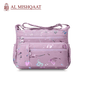 Large stylish crossbody alphabet bag in lavender with multicolor letter print, featuring multiple zippered compartments for fashion and versatility.
