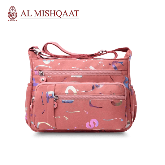 Large stylish crossbody alphabet bag in lavender with multicolor letter print, featuring multiple zippered compartments for fashion and versatility.
