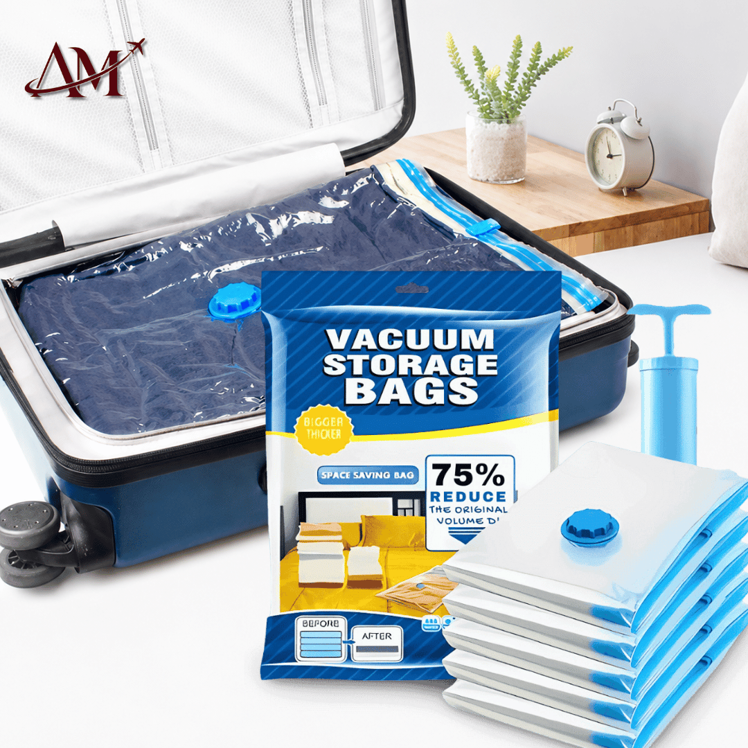 Vacuum storage bags shown with their blue-and-white retail packaging, a stack of sealed clear-and-blue bags, a blue hand pump, and an open suitcase containing folded bags. The scene is styled on a white surface with a small plant and clock in the background.