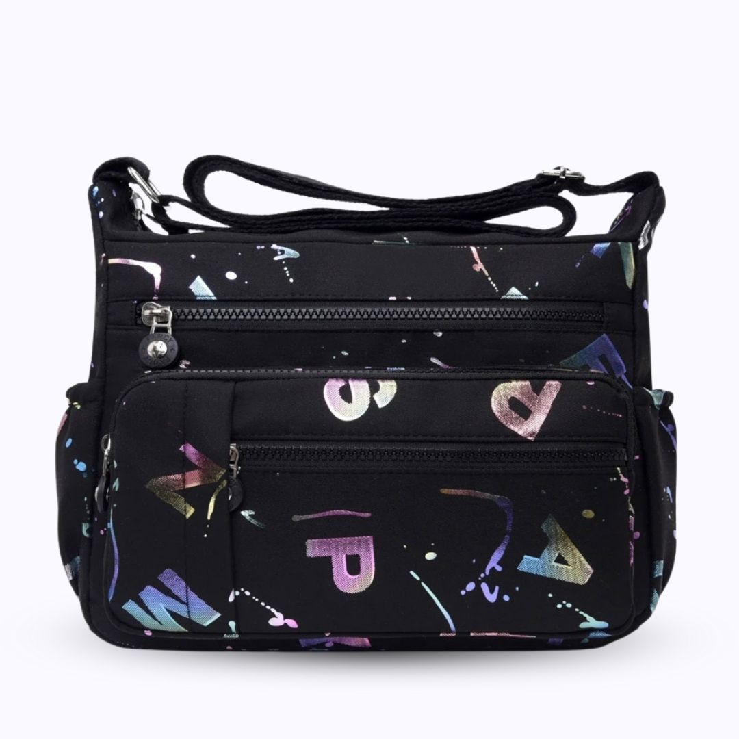 Large stylish crossbody alphabet bag in black with colorful letter print, featuring multiple zippered compartments for fashion and versatility.