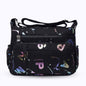 Large stylish crossbody alphabet bag in black with colorful letter print, featuring multiple zippered compartments for fashion and versatility.