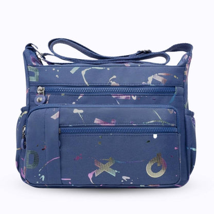 Large stylish crossbody alphabet bag in navy blue with multicolor letter prints and multiple zippered compartments for fashion and versatility.